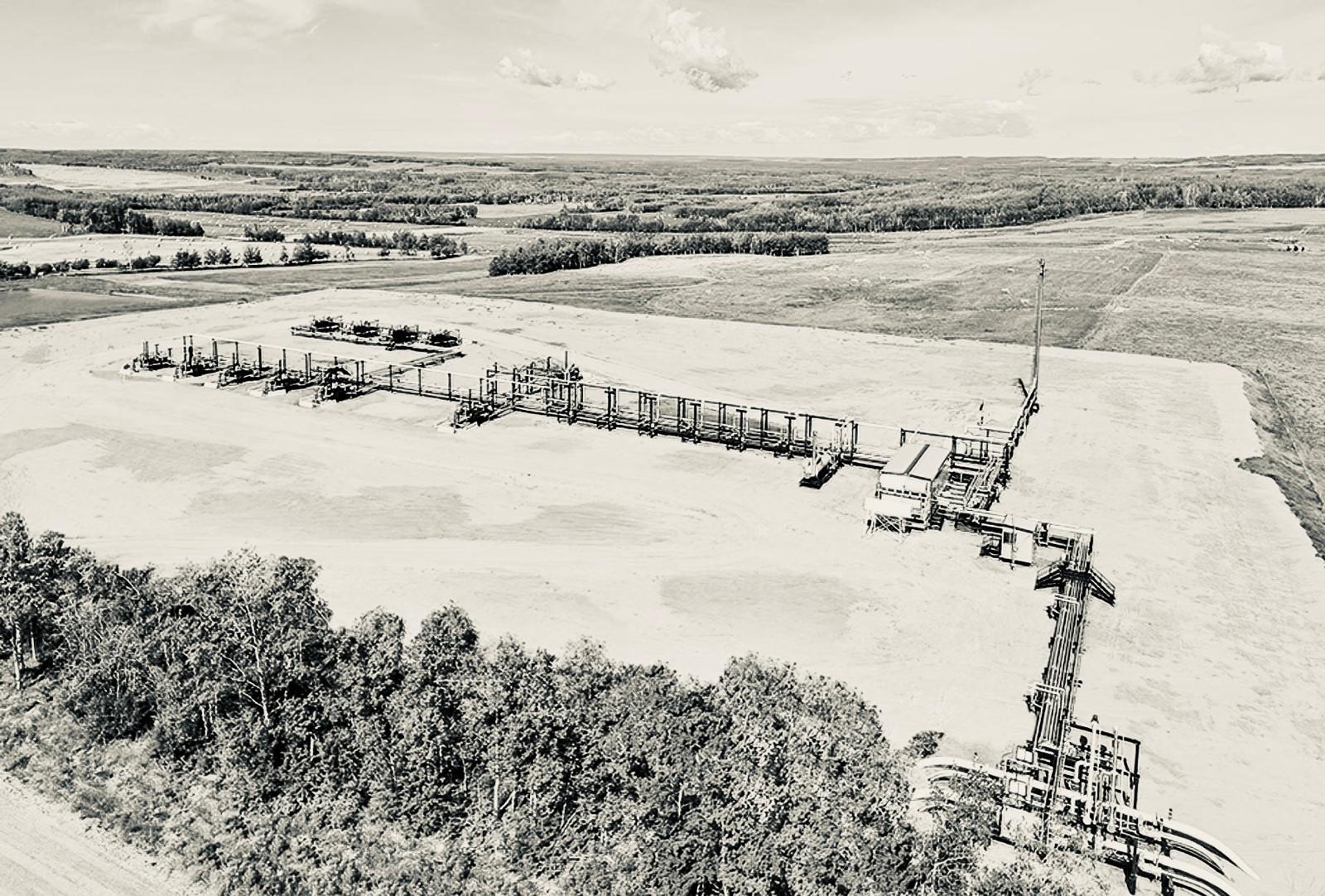 Aerial view of oil field at dawn